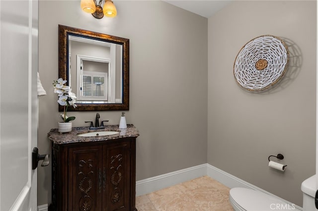 475 W 26th St, Upland, CA 91784 - bathroom with toilet, vanity, and baseboards