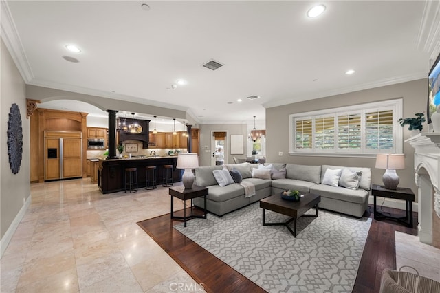 475 W 26th St, Upland, CA 91784 - living room with ornate columns, ornamental molding, recessed lighting, a fireplace, and baseboards
