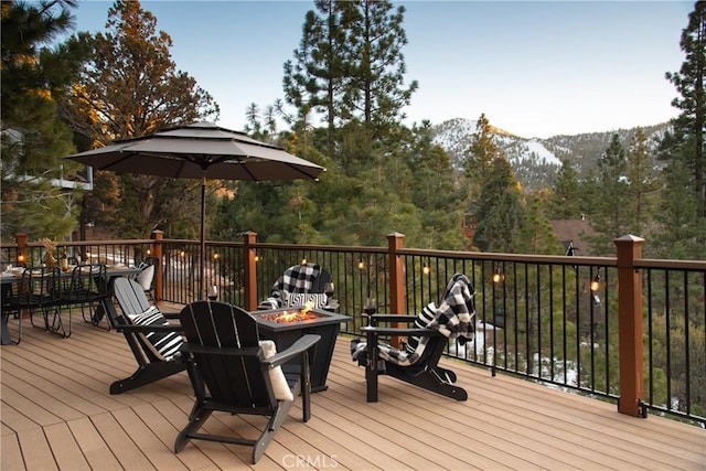43620 Colusa Dr, Big Bear Lake, CA 92315 - wooden terrace with a fire pit and a mountain view