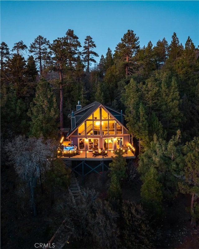43620 Colusa Dr, Big Bear Lake, CA 92315 - rear view of house with a wooded view, a deck, and stairway