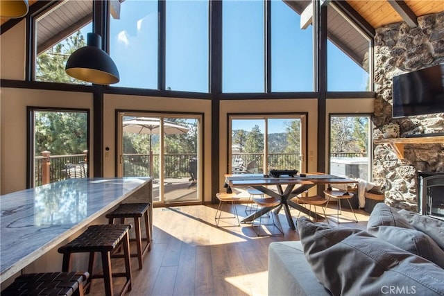 43620 Colusa Dr, Big Bear Lake, CA 92315 - living area featuring beam ceiling, wood ceiling, plenty of natural light, wood-type flooring, and high vaulted ceiling