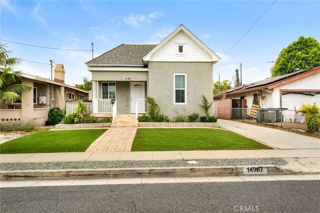 14907 S Raymond Ave, Gardena, CA 90247 - bungalow-style home with stucco siding, covered porch, roof with shingles, and a gate