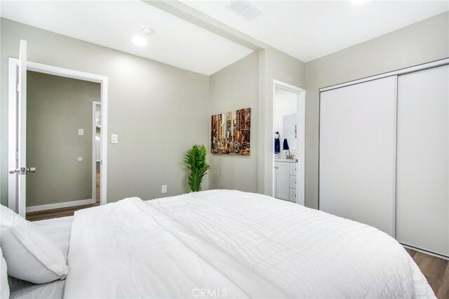 14907 S Raymond Ave, Gardena, CA 90247 - bedroom with wood finished floors and a closet