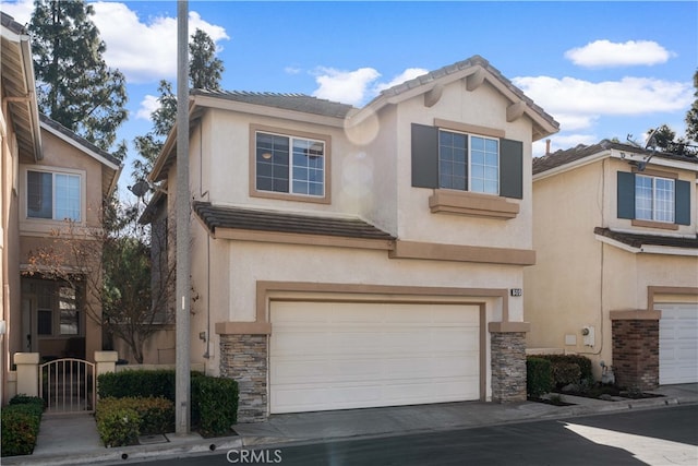59 Cape Victoria, Aliso Viejo, CA 92656 - traditional-style home featuring an attached garage, stucco siding, stone siding, and concrete driveway