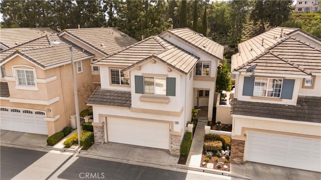 59 Cape Victoria, Aliso Viejo, CA 92656 - view of front of home featuring a garage, concrete driveway, stucco siding, and a tile roof