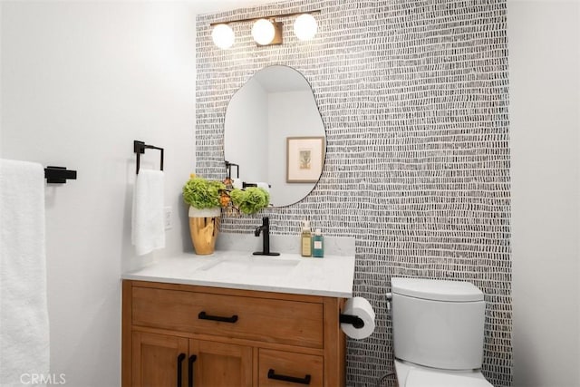59 Cape Victoria, Aliso Viejo, CA 92656 - half bath featuring vanity, tile walls, and decorative backsplash