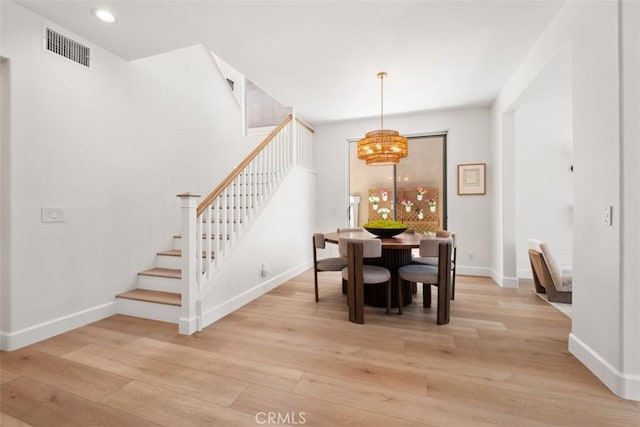 59 Cape Victoria, Aliso Viejo, CA 92656 - dining area with stairway, light wood finished floors, a chandelier, and recessed lighting