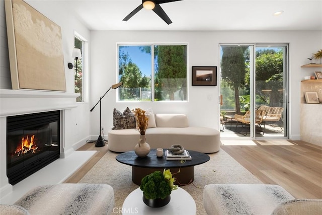 59 Cape Victoria, Aliso Viejo, CA 92656 - living room featuring wood finished floors, ceiling fan, a glass covered fireplace, and recessed lighting