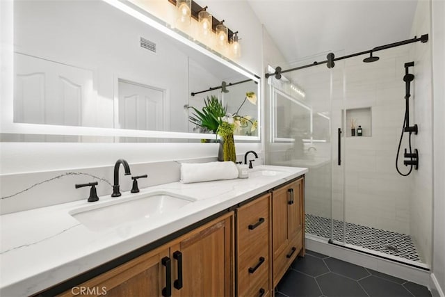 59 Cape Victoria, Aliso Viejo, CA 92656 - full bath featuring double vanity, a shower stall, and tile patterned flooring