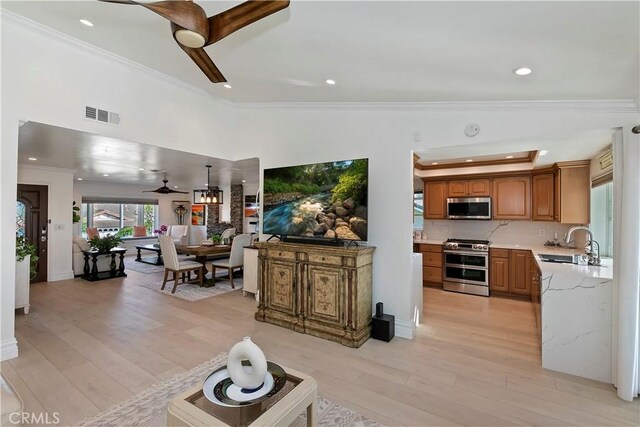 2546 N Orange Hill Ln, Orange, CA 92867 - living room with ornamental molding, light wood-style floors, ceiling fan, recessed lighting, and vaulted ceiling