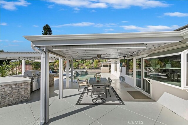 2546 N Orange Hill Ln, Orange, CA 92867 - view of patio / terrace featuring area for grilling, a pool with connected hot tub, fence, and grilling area