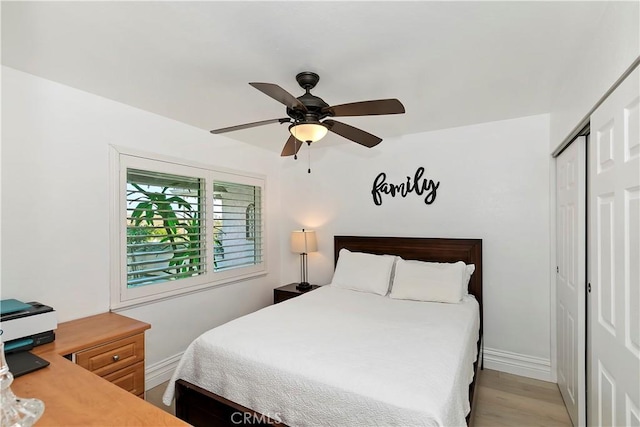 2546 N Orange Hill Ln, Orange, CA 92867 - bedroom featuring a closet, baseboards, light wood finished floors, and a ceiling fan