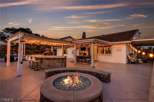 2546 N Orange Hill Ln, Orange, CA 92867 - patio terrace at dusk featuring a fire pit