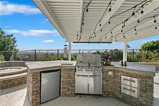 2546 N Orange Hill Ln, Orange, CA 92867 - view of patio / terrace featuring an outdoor kitchen, a fenced backyard, a grill, and an outdoor fire pit