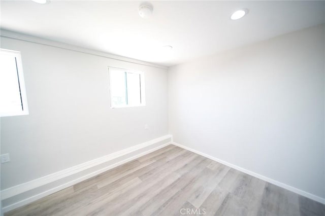 1336 W 118th St, Los Angeles, CA 90044 - empty room with light wood-style flooring, baseboards, and recessed lighting