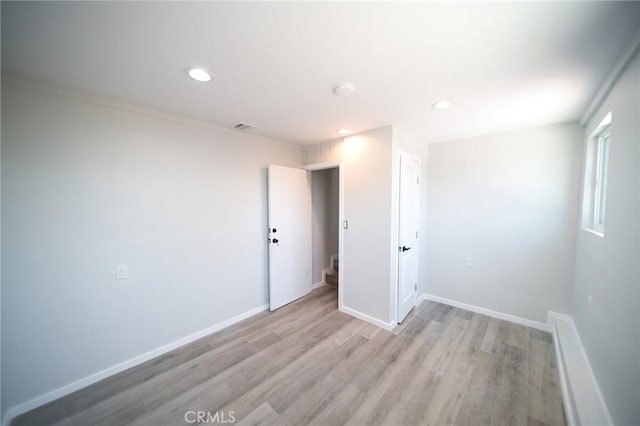 1336 W 118th St, Los Angeles, CA 90044 - spare room featuring light wood finished floors, recessed lighting, and baseboards