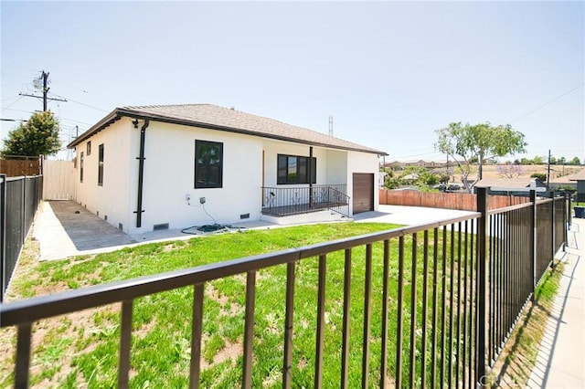 1336 W 118th St, Los Angeles, CA 90044 - back of house with crawl space, stucco siding, and a garage