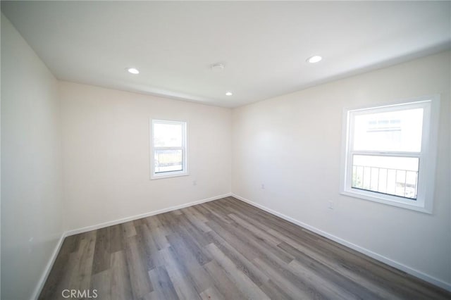 1336 W 118th St, Los Angeles, CA 90044 - spare room featuring wood finished floors, baseboards, and recessed lighting