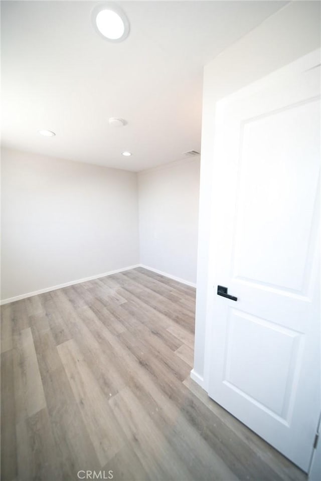 1336 W 118th St, Los Angeles, CA 90044 - empty room with wood finished floors, baseboards, and recessed lighting