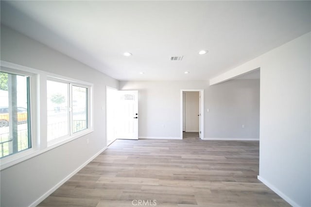 1336 W 118th St, Los Angeles, CA 90044 - empty room with baseboards, light wood-type flooring, and recessed lighting