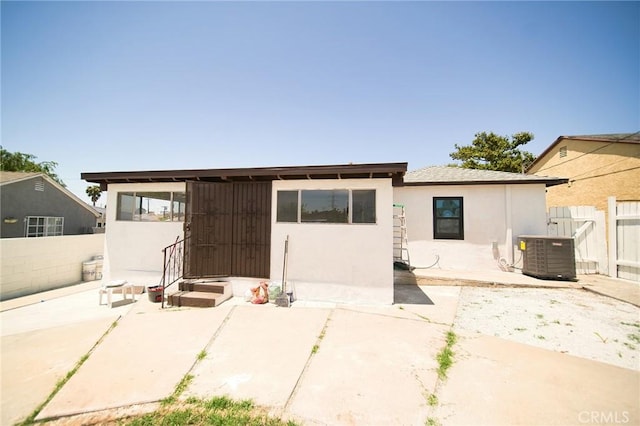 1336 W 118th St, Los Angeles, CA 90044 - back of house featuring central air condition unit, a fenced backyard, a patio, and stucco siding
