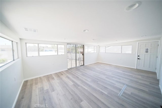 1336 W 118th St, Los Angeles, CA 90044 - empty room with baseboards and light wood-style flooring