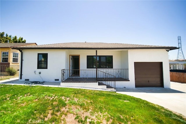 1336 W 118th St, Los Angeles, CA 90044 - ranch-style house with concrete driveway, stucco siding, a porch, and an attached garage