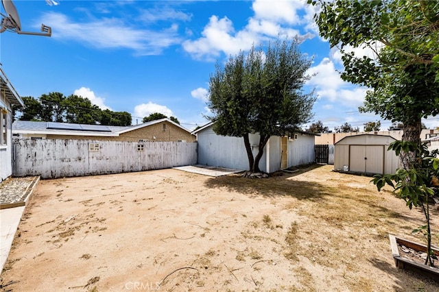 368 W St, Upland, CA 91786 - fenced backyard with a storage unit and an outdoor structure