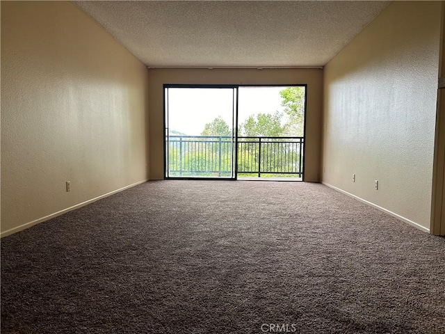 4499 Via Marisol Unit 327, Los Angeles, CA 90042 - carpeted empty room featuring a textured wall and a textured ceiling