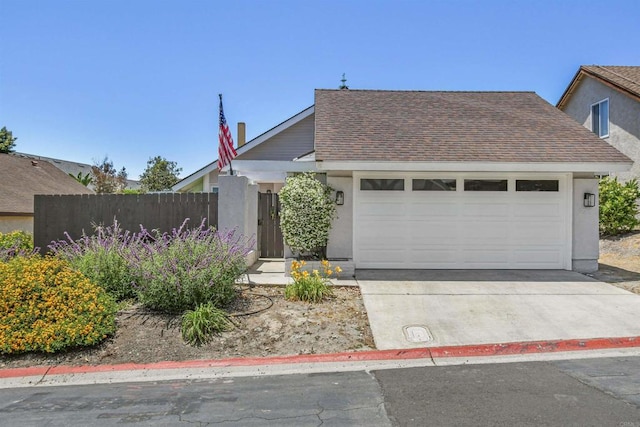 2610 Hillridge Ln, Spring Valley, CA 91977 - view of front of home with stucco siding, a garage, concrete driveway, and roof with shingles