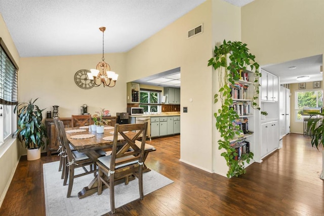 2610 Hillridge Ln, Spring Valley, CA 91977 - dining area with a chandelier, dark wood-style flooring, and high vaulted ceiling