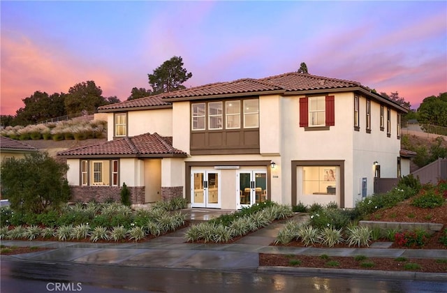 1381 Amanda Gln S, Escondido, CA 92025 - mediterranean / spanish-style house featuring stucco siding, french doors, brick siding, and a tile roof