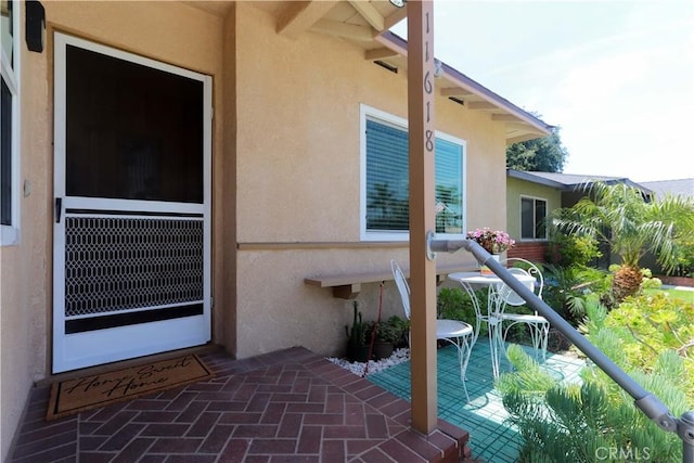 11618 Cedarvale St, Norwalk, CA 90650 - doorway to property with stucco siding and a balcony