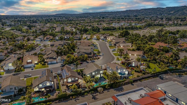 aerial perspective of suburban area with a mountainous background