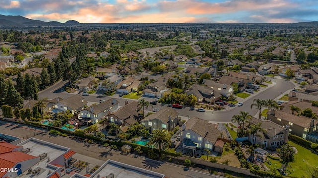 aerial view at dusk of a residential view and a mountain view