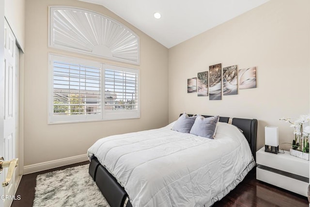 bedroom with wood finished floors, vaulted ceiling, baseboards, and recessed lighting