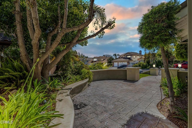view of patio terrace at dusk