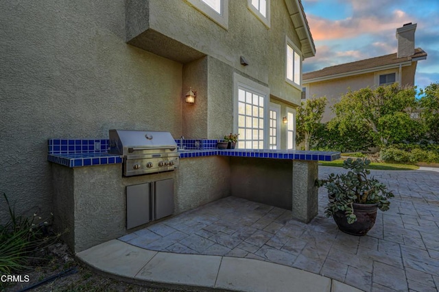 view of patio with grilling area and exterior kitchen
