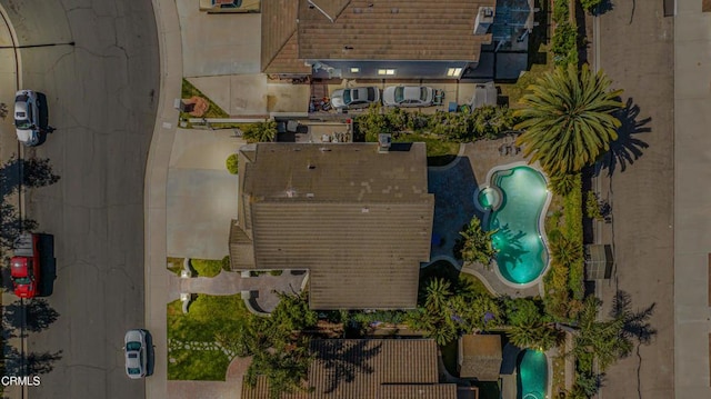 drone / aerial view of a pool