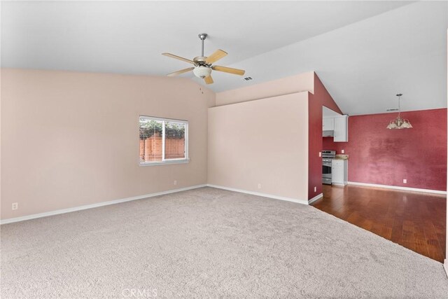 448 Grove Ln, Nipomo, CA 93444 - unfurnished living room featuring carpet flooring, vaulted ceiling, a ceiling fan, and baseboards