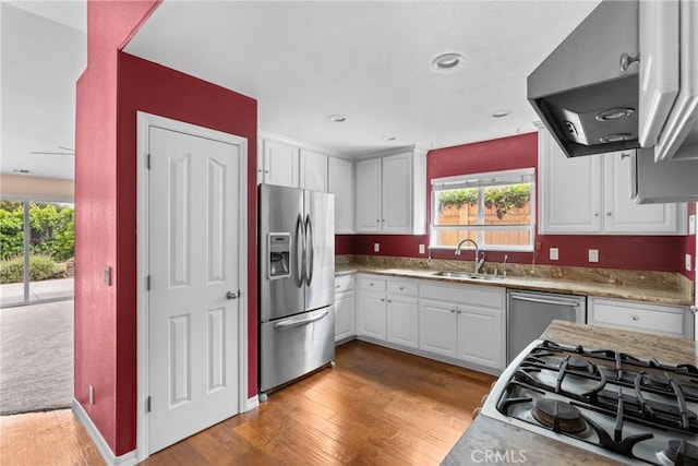 448 Grove Ln, Nipomo, CA 93444 - kitchen featuring stainless steel appliances, a sink, white cabinetry, light wood-style floors, and recessed lighting