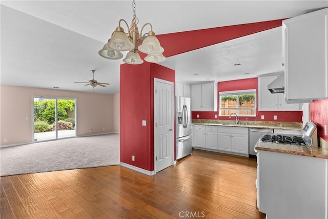448 Grove Ln, Nipomo, CA 93444 - kitchen with stainless steel fridge, dishwashing machine, a chandelier, light wood finished floors, and a sink