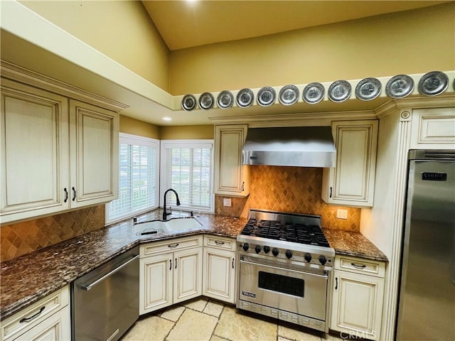 10061 Cozycroft Ave, Chatsworth, CA 91311 - kitchen featuring appliances with stainless steel finishes, wall chimney exhaust hood, a sink, cream cabinetry, and decorative backsplash