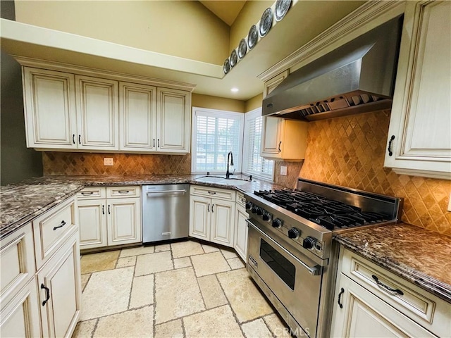 10061 Cozycroft Ave, Chatsworth, CA 91311 - kitchen with stainless steel appliances, a sink, ventilation hood, backsplash, and stone tile flooring