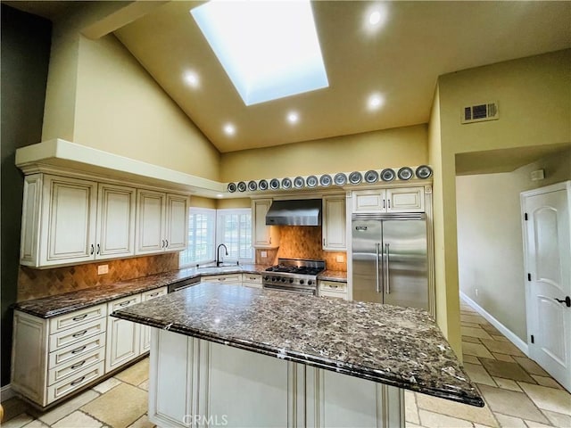 10061 Cozycroft Ave, Chatsworth, CA 91311 - kitchen featuring high end appliances, wall chimney exhaust hood, a sink, backsplash, and a kitchen island