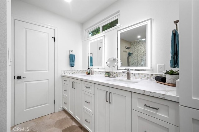 full bathroom featuring a shower stall and double vanity