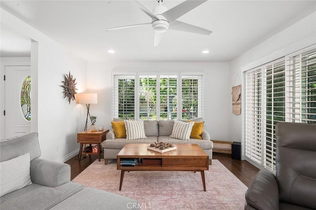 living room with wood finished floors, ceiling fan, baseboards, and recessed lighting