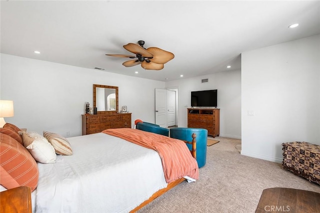 bedroom featuring recessed lighting, light colored carpet, ceiling fan, and baseboards