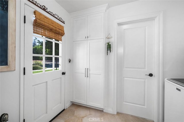 doorway to outside featuring light tile patterned floors