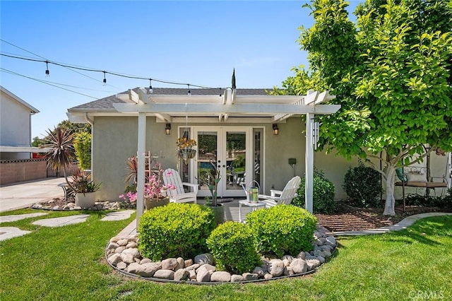 rear view of property featuring french doors, stucco siding, and a pergola